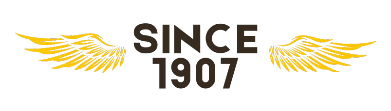 Since 1907 logo with golden wings, a symbol of quality and tradition. This emblem represents our commitment to excellence and long-standing service.